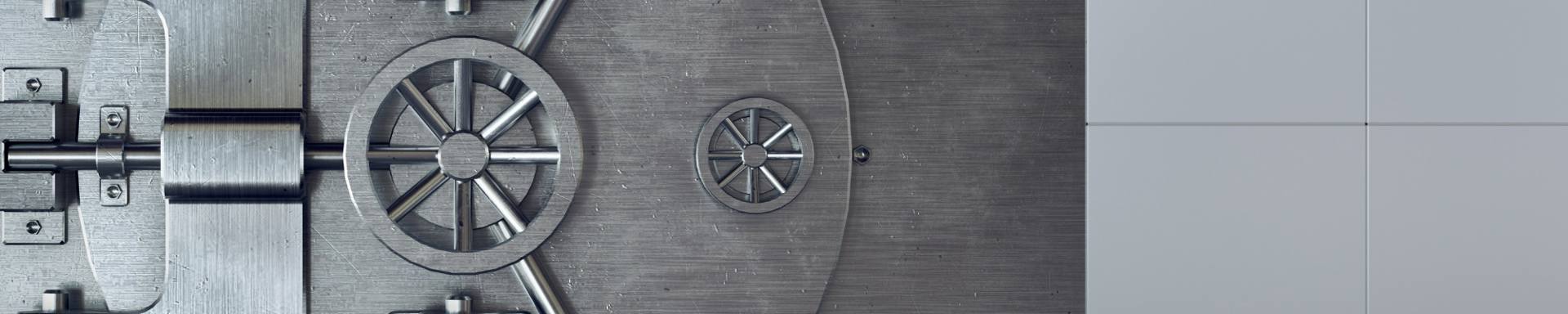 A robust metal safe equipped with a keyhole, illustrating a secure method for safeguarding valuables.